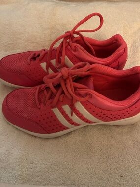 Adidas women’s bright pink running shoes